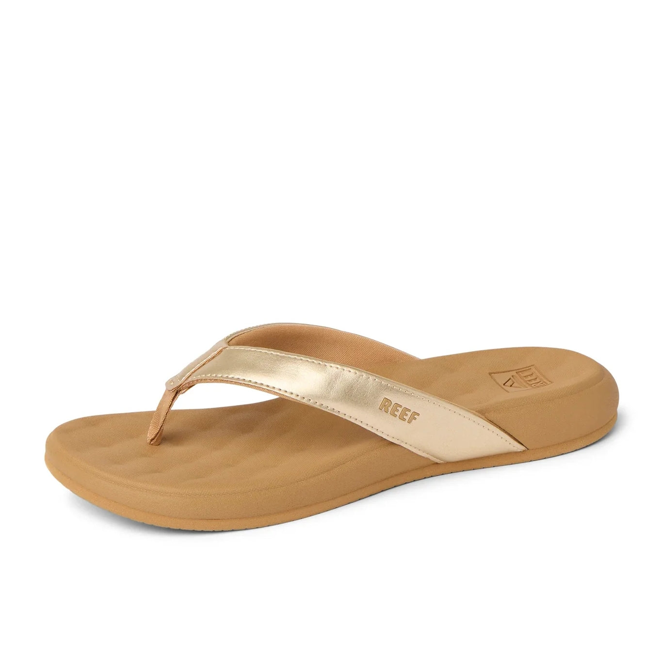Front view of women's Reef Cushion Melody flip flops with a Champage Gold strap with logo and pillow textured cushioning footbed.