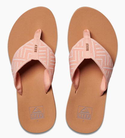 Reef womens peach flip flops with patterned fabric straps and cushioned brown footbeds