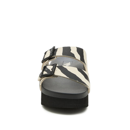Front view of womens Rocket Dog Esti Plus platform slip on sandals, with two black and white zebra print straps with buckles.
