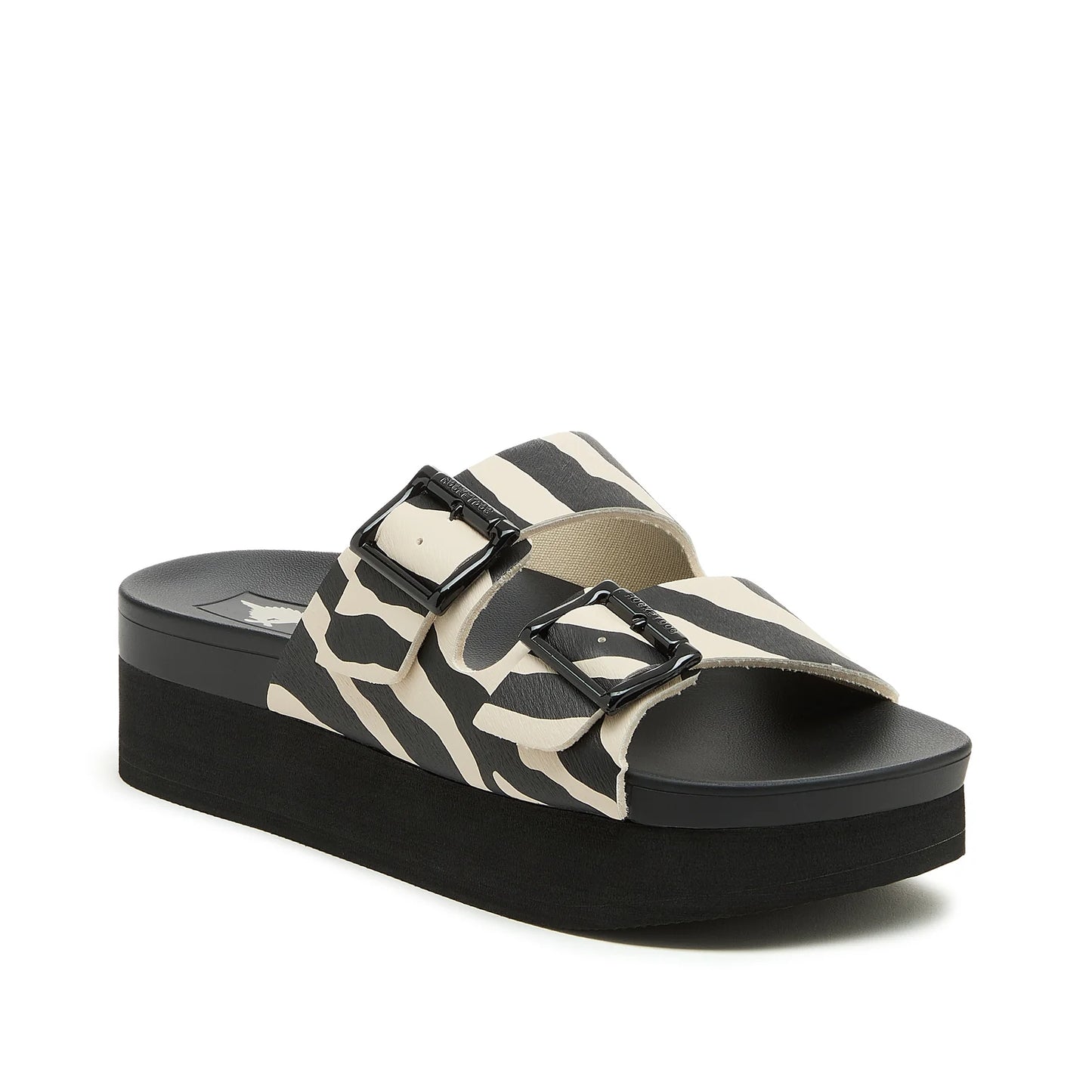 Front view of womens Rocket Dog Esti Plus slip on sandals, with a platform sole and two black and white zebra print straps with buckles.
