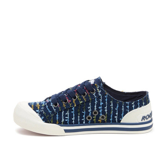 Side view of Rocket Dog women's Jazzin Radio canvas lace up trainers in navy blue with a multicolour striped stitching pattern and side vent holes.