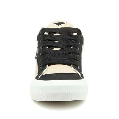 Front view of womens Rocket Dog Cheery colour block lace-up trainers with beige and black panels, white sole and black shoe laces.