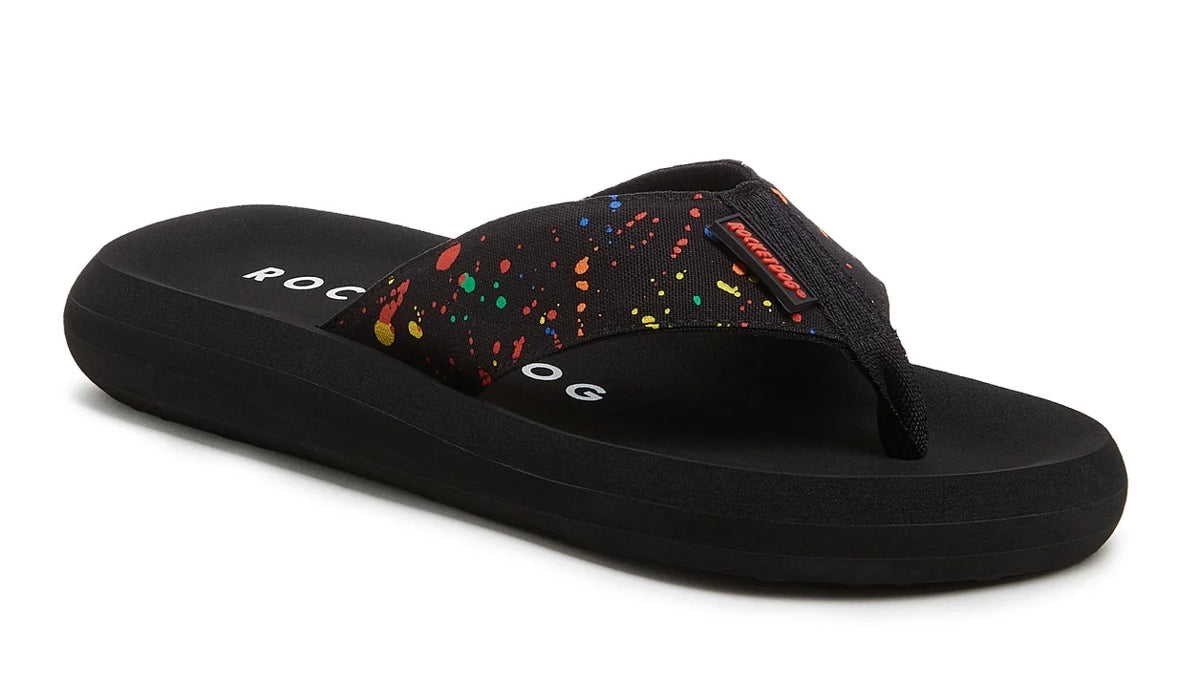 Rocket Dog women's Spotlight flip flops in Black with multicoloured splash pattern.