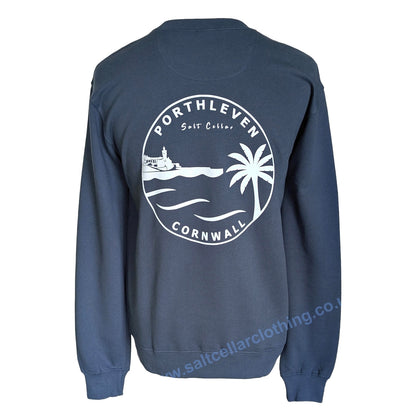 A Petrol blue unisex crewneck sweatshirt shown from the back, featuring a large white circular graphic print that reads 'PORTHLEVEN Salt Cellar CORNWALL' with a harbourside clocktower, palm tree, and waves.