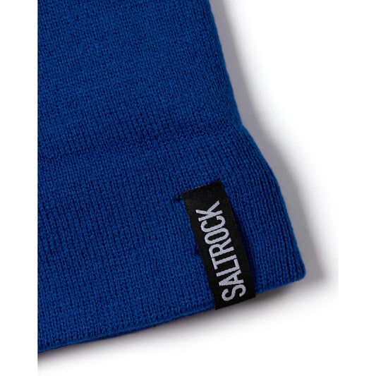 Blue knit Ok beanie with a Saltrock label on a white background
