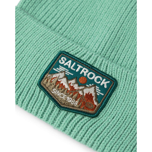 Close up of a Saltrock Uplands light green beanie with a Saltrock patch featuring mountain design