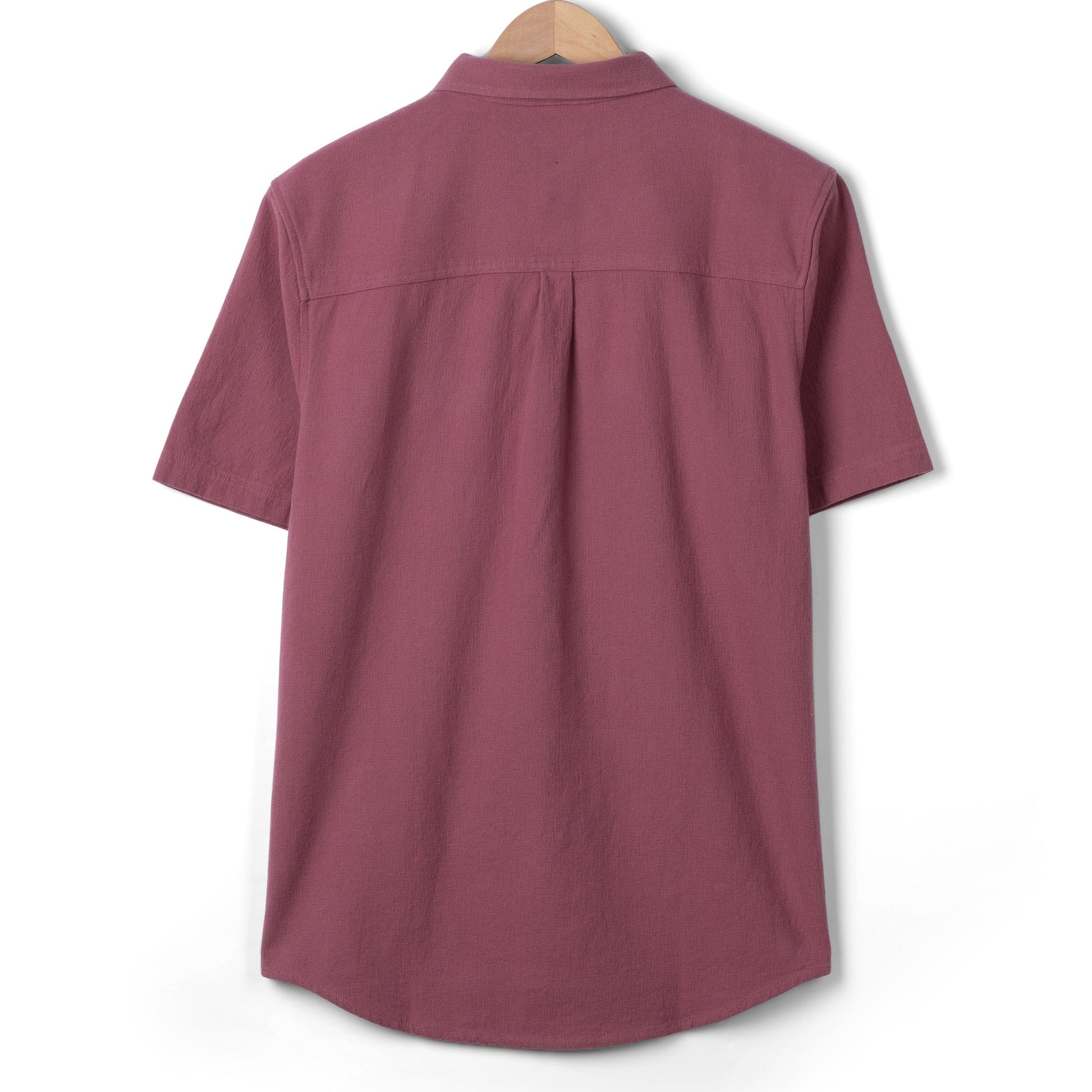 Back view of a men's Saltrock short sleeve Polperro button through shirt in dark pink.