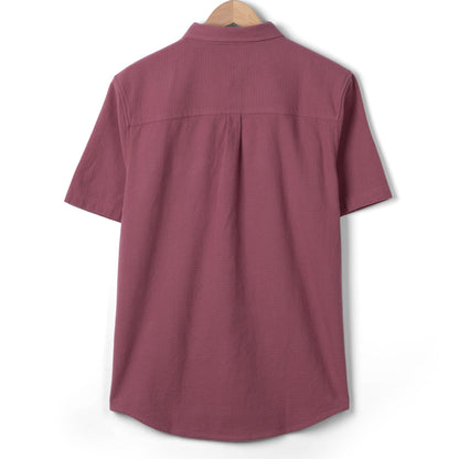 Back view of a men's Saltrock short sleeve Polperro button through shirt in dark pink.