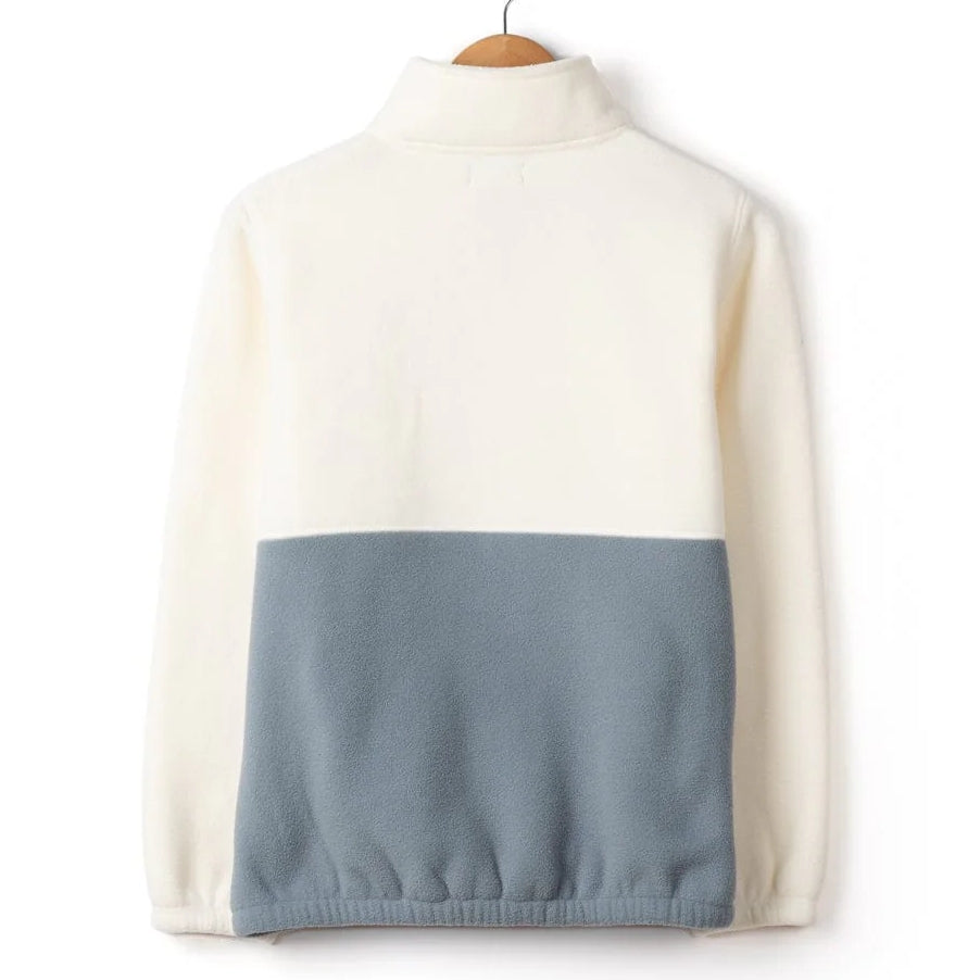 Back view of a womens Saltrock Denya colour block fleece in cream and blue on a hanger against a white background