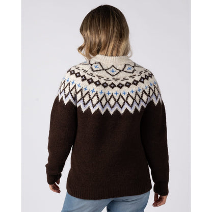 Back view of a woman wearing a Saltrock Fern jumper in brown with a Fairisle style cream, blue and brown pattern across the chest and shoulders.