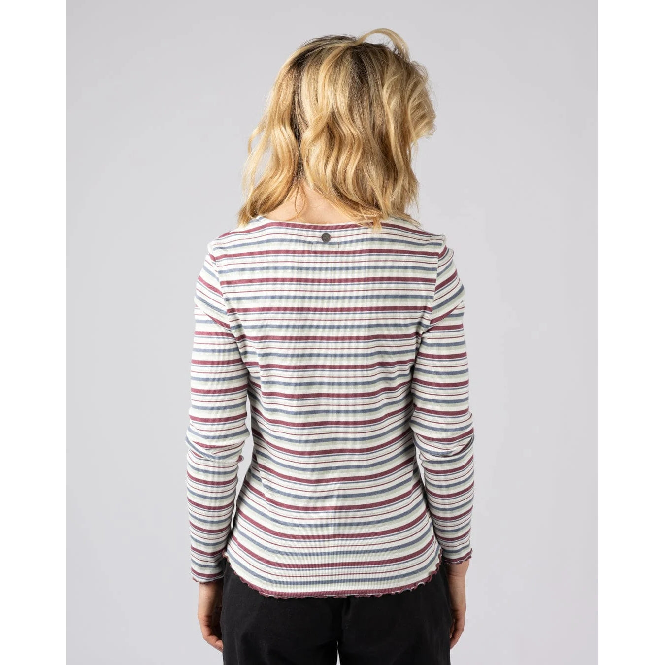 Back view of a woman wearing a Saltrock long sleeve Lenna t-shirt in white with a multicolour stripe pattern