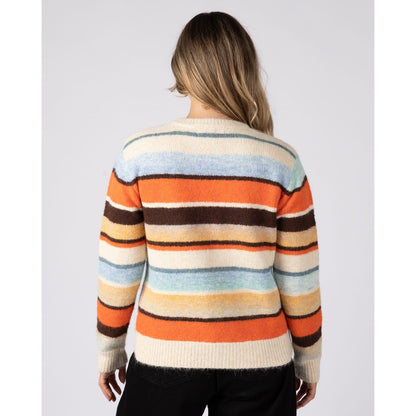 Back view of a woman wearing a Saltrock Lyris crew neck knitted jumper in an orange, cream and multicolour striped pattern.
