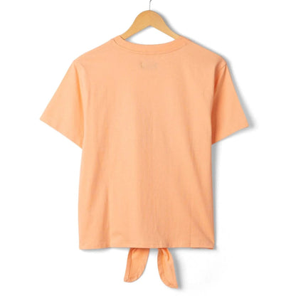 Back view of a Saltrock womens short sleeve Trader Daze t-shirt in peach, with logo print on the chest and a knot tie hem.