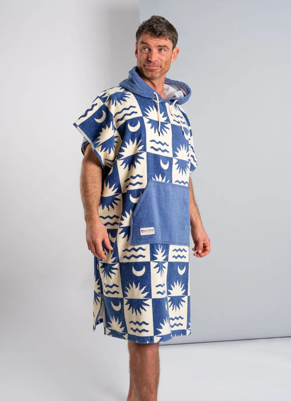 Saltrock changing towel robe blue with sun and wave patterns worn by man with hood and pocket