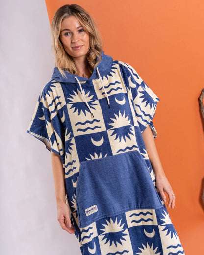 Saltrock changing towel robe blue with sun and moon patterns worn by woman with hood and front pocket