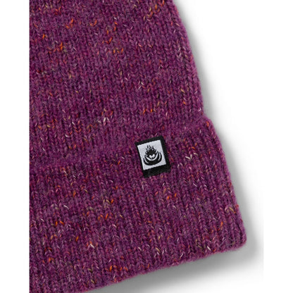 Close-up view of the turn back hem and logo label of an adults Saltrock Brushed Maine knitted beanie in purple.