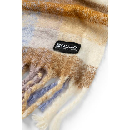 Close-up view of a Saltrock Harvest scarf in a check pattern of brown, cream and purple with tasselled ends and a black logo label.
