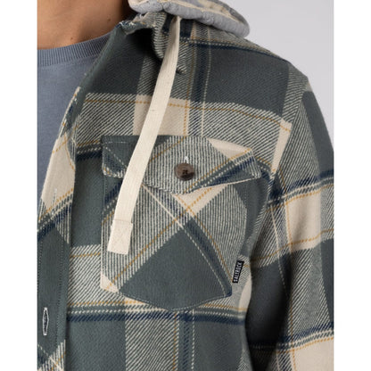 Close-up view of a check pocket on a mens Saltrock Strait long sleeve check shirt in dark teal green.