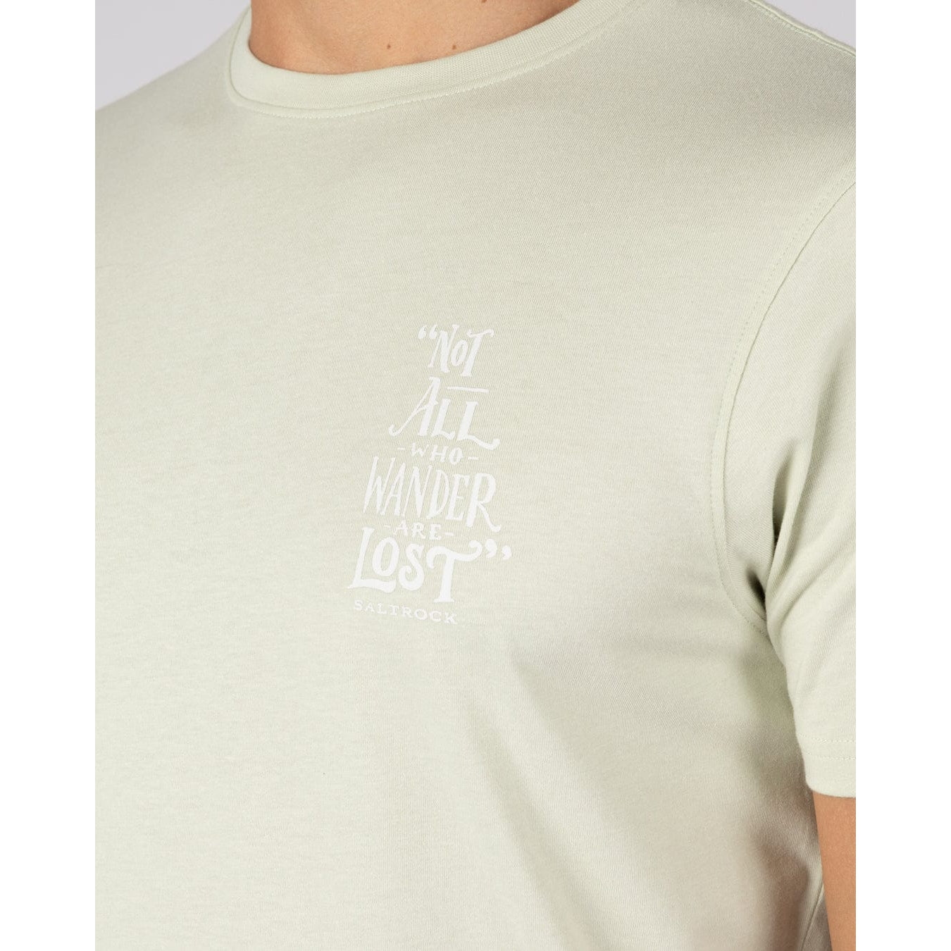 Close-up view of the "Not all who Wander are Lost" print on the front of a men's Saltrock light green Lost Ships t-shirt