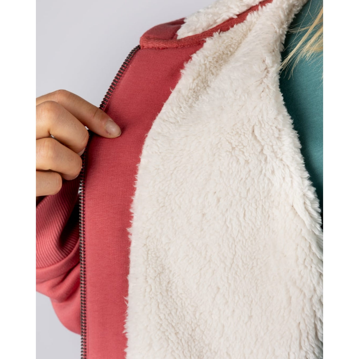 Close-up of the fluffy white Borg lining of a womens Saltrock full zip Borg lined Tamsin hoodie in Pink