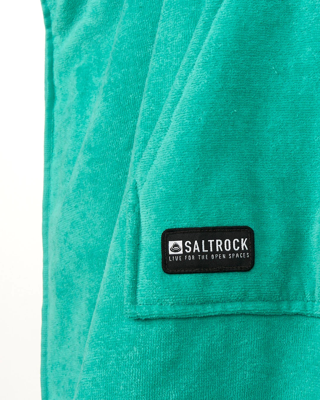 Saltrock Corp changing towel robe in Turquoise close-up showing soft terry fabric and Saltrock label
