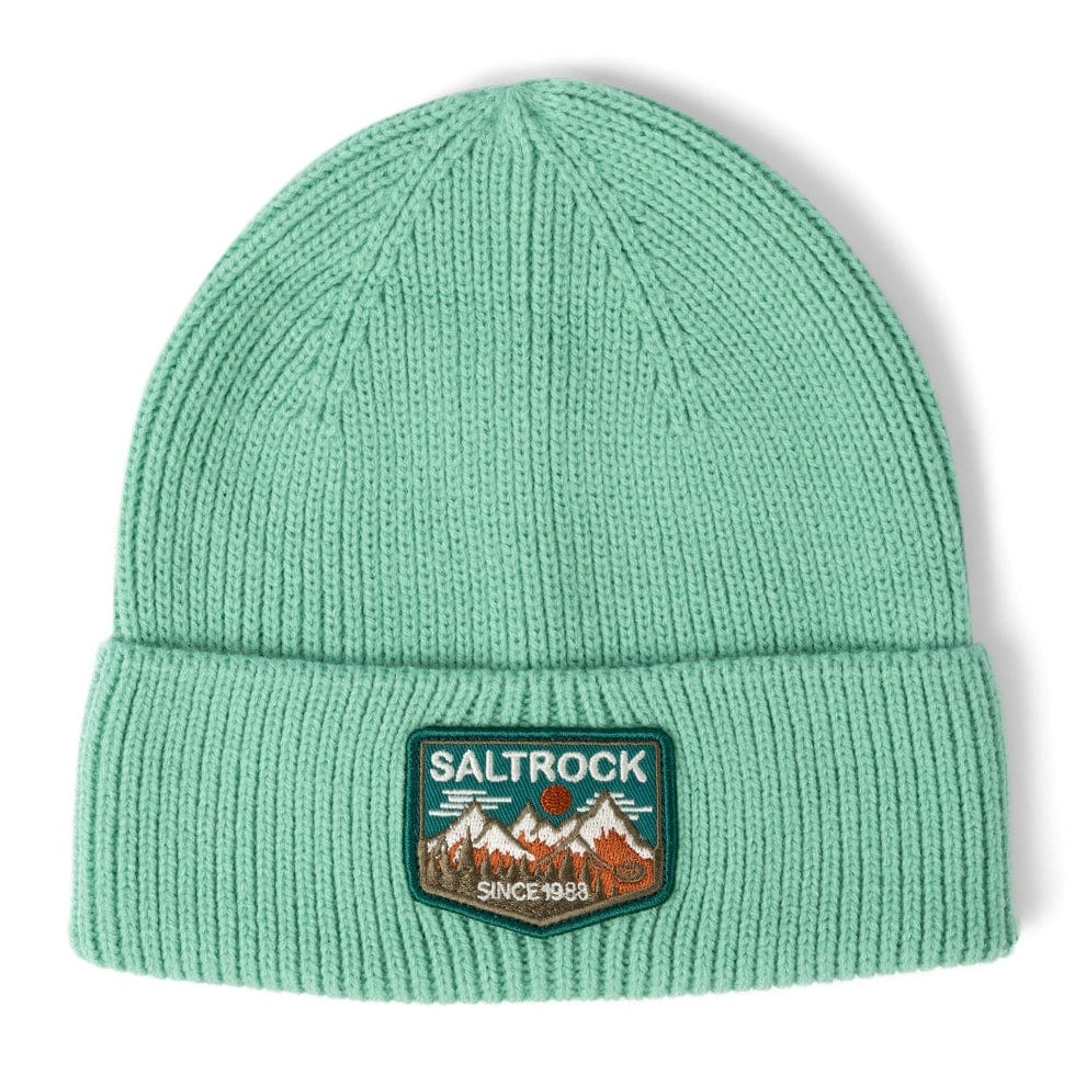 Front view of a Saltrock light green Uplands beanie with turn-up hem and mountains logo patch on a white background