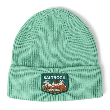 Front view of a Saltrock light green Uplands beanie with turn-up hem and mountains logo patch on a white background