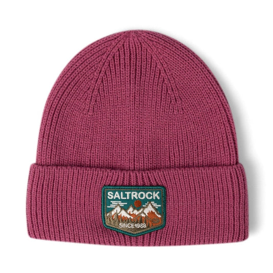 Front view of a Dark Pink Saltrock knitted beanie with turn-up hem and mountains logo patch on a white background