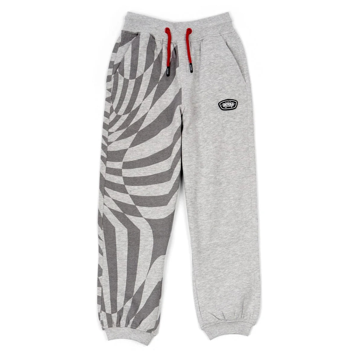 Front view of a pair of kids Saltrock Rip It jogger sweat trousers in grey with a geometric print on one leg