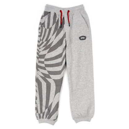 Front view of a pair of kids Saltrock Rip It jogger sweat trousers in grey with a geometric print on one leg