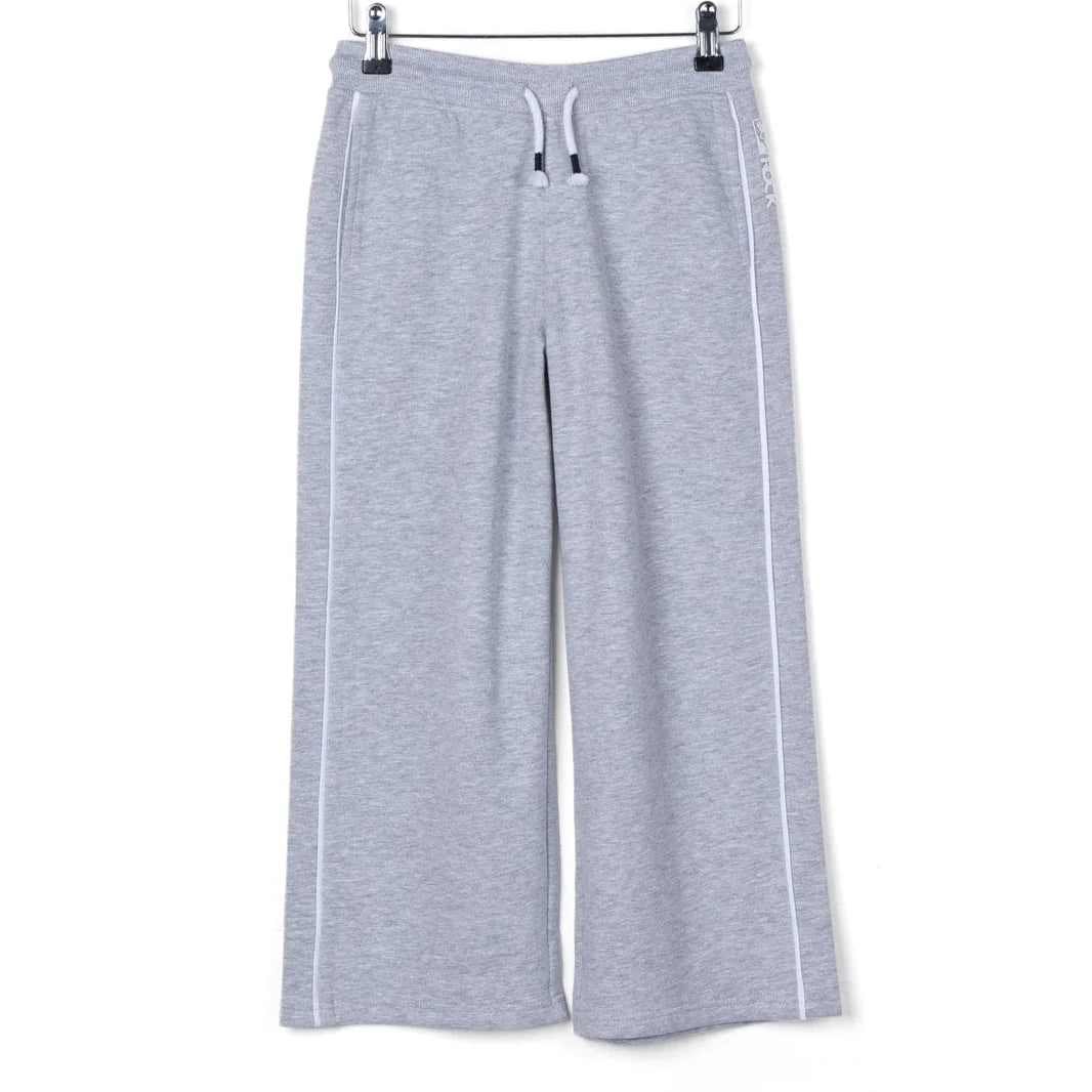 Front view of kids Saltrock Tok Corp jogger trousers in grey with elasticated drawstring waist with white piping down the side of the legs.