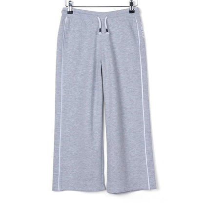 Front view of kids Saltrock Tok Corp jogger trousers in grey with elasticated drawstring waist with white piping down the side of the legs.