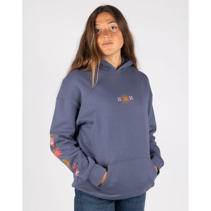 Front view of a woman wearing a Saltrock Athena pop hoodie in Dark Blue, featuring a tummy pocket, small print on the chest of sun and check pattern and another print along one sleeve.