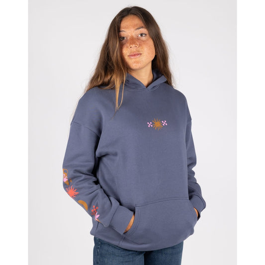 Front view of a woman wearing a Saltrock Athena pop hoodie in Dark Blue, featuring a tummy pocket, small print on the chest of sun and check pattern and another print along one sleeve.