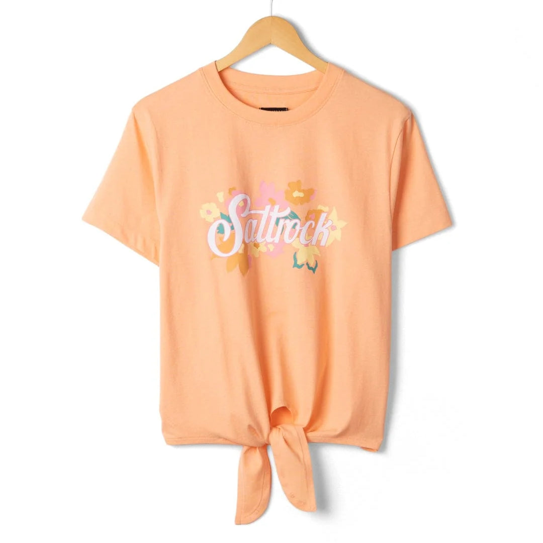 Front view of a Saltrock womens short sleeve Trader Daze t-shirt in peach, with logo print on the chest and a knot tie hem.