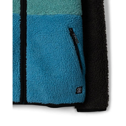 Close-up view of the tummy zip pocket  and logo on a kids Saltrock Tok Emery fleece jacket in blue, black and teal.