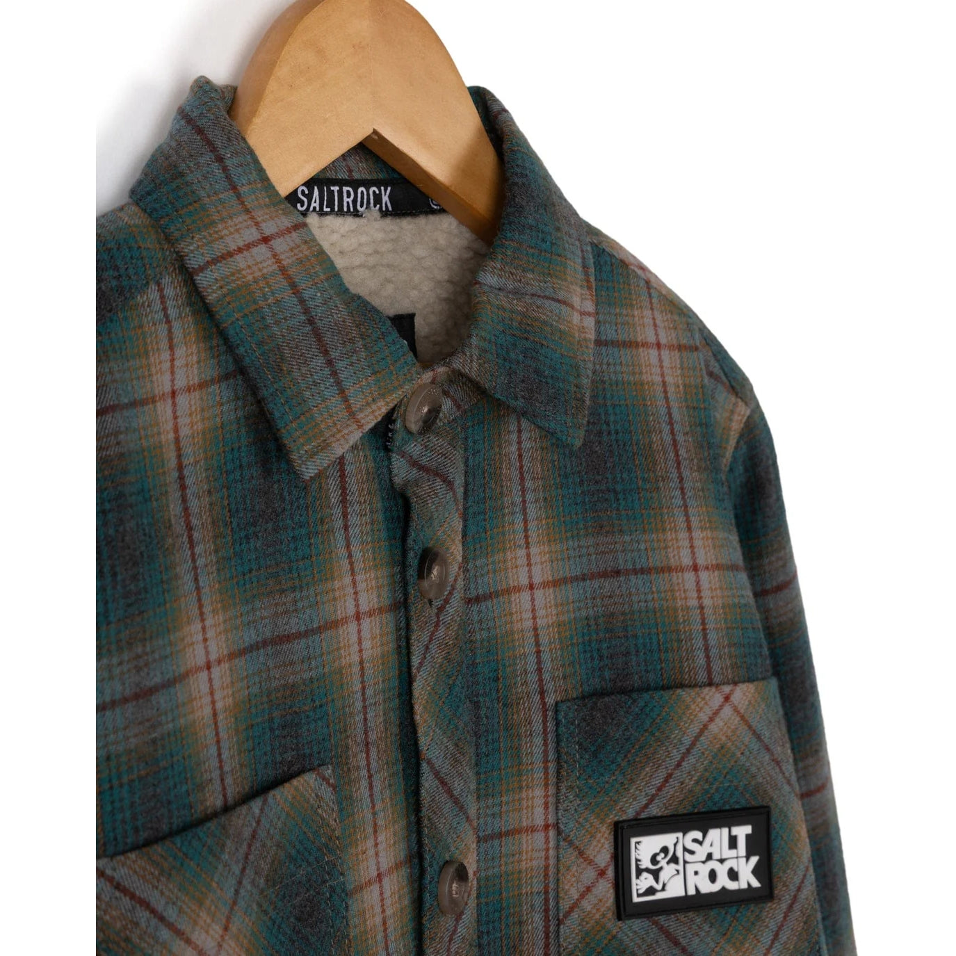 Saltrock kids Wiley check shirt shacket with a visible brand label on a wooden hanger against a white background