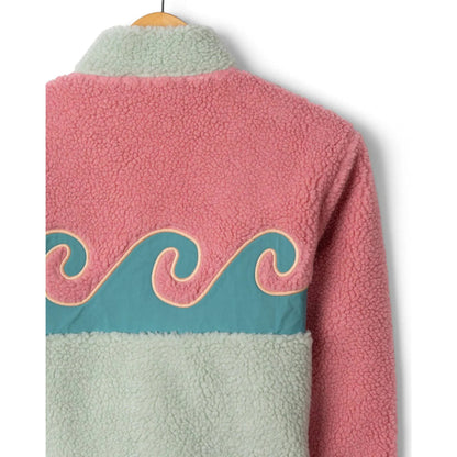 Close-up view of the back of a Saltrock kids Emery Wave fleece with wave applique on the back, in pink, turquoise and teal