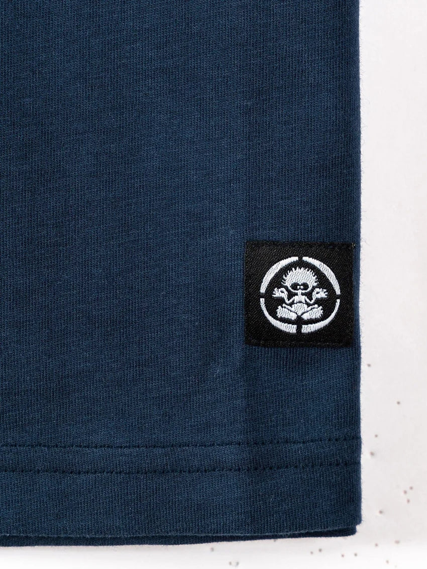 Close-up of Saltrock kids stripe tee blue showing navy fabric and black logo patch