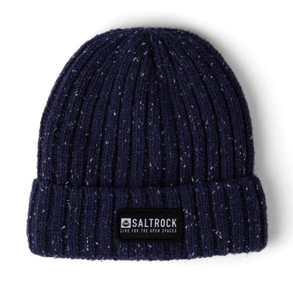 Main front view of a Saltrock adults Heritage beanie in navy with a white fleck, ribbed knit texture, faux fur lining and a turnup hem with logo patch.