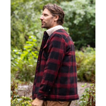 Side view of a man wearing a Saltrock Fisher Borg lined shacket with a dark red and black check pattern outer fabric and a cream collar lining.
