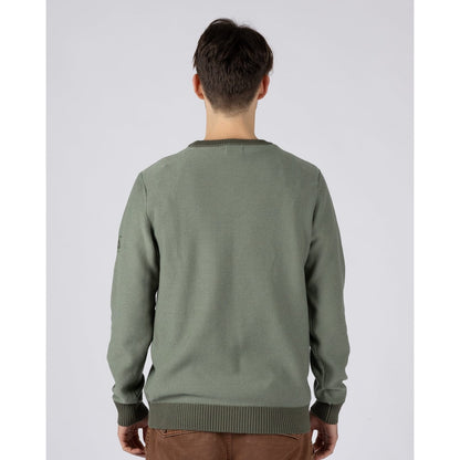 Back view of a man wearing a green Saltrock knitted Callum jumper with ribbed neckline, cuffs and bottom hem