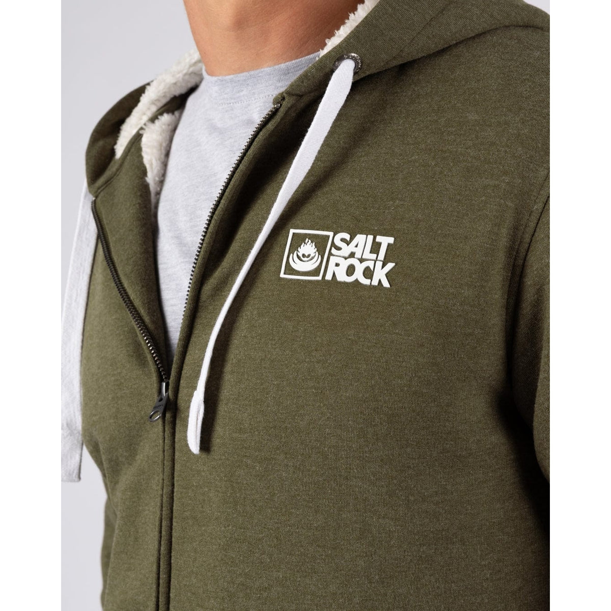 Close-up view of the chest logo of a Saltrock mens Essential full zip lined hoodie in khaki green.