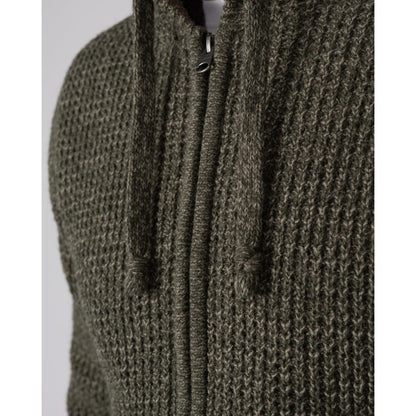 Close-up view of the zip and chunky knitted outer fabric of a Saltrock dark green Markus zip hoodie.
