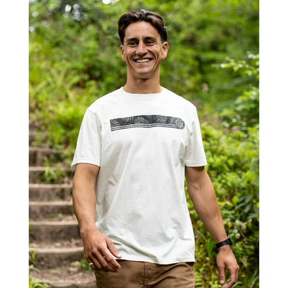 Man wearing a Saltrock short sleeve Warp Surf Stripe t-shirt in cream with print across the chest outdoors