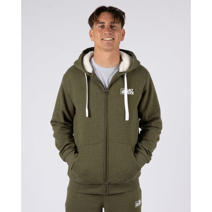 Front view of a man wearing a Saltrock Essential full zip faux fur lined hoodie in khaki green with his hands in the tummy pockets.