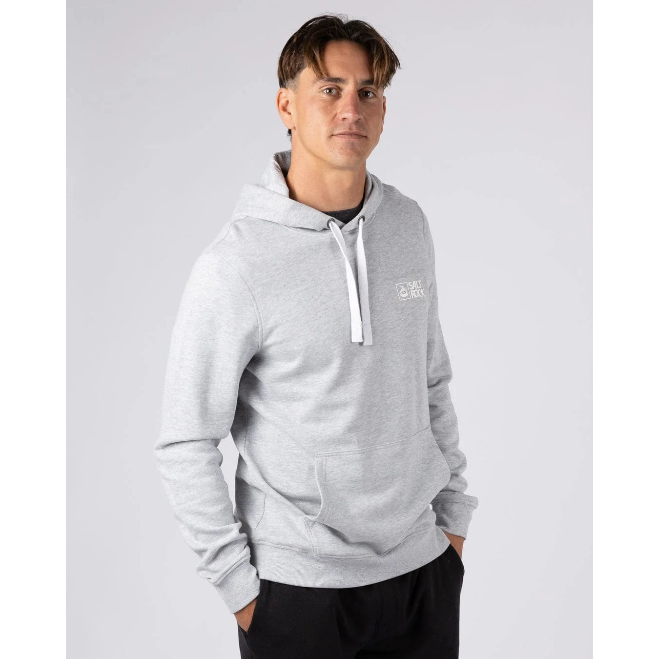 Man wearing a grey Saltrock Original pop hoodie with a logo on a light gray background