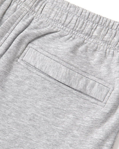 Close up of the elastic waist and back pocket of a pair of mens Saltrock grey jogger sweat trousers on a white background