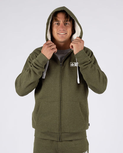 A man wearing a Saltrock Essential full zip faux fur lined hoodie in khaki green with the hood up.