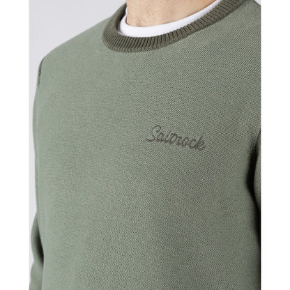 Close-up view of a mens Saltrock green Callum knitted jumper with logo embroidered on the chest and ribbed neckline